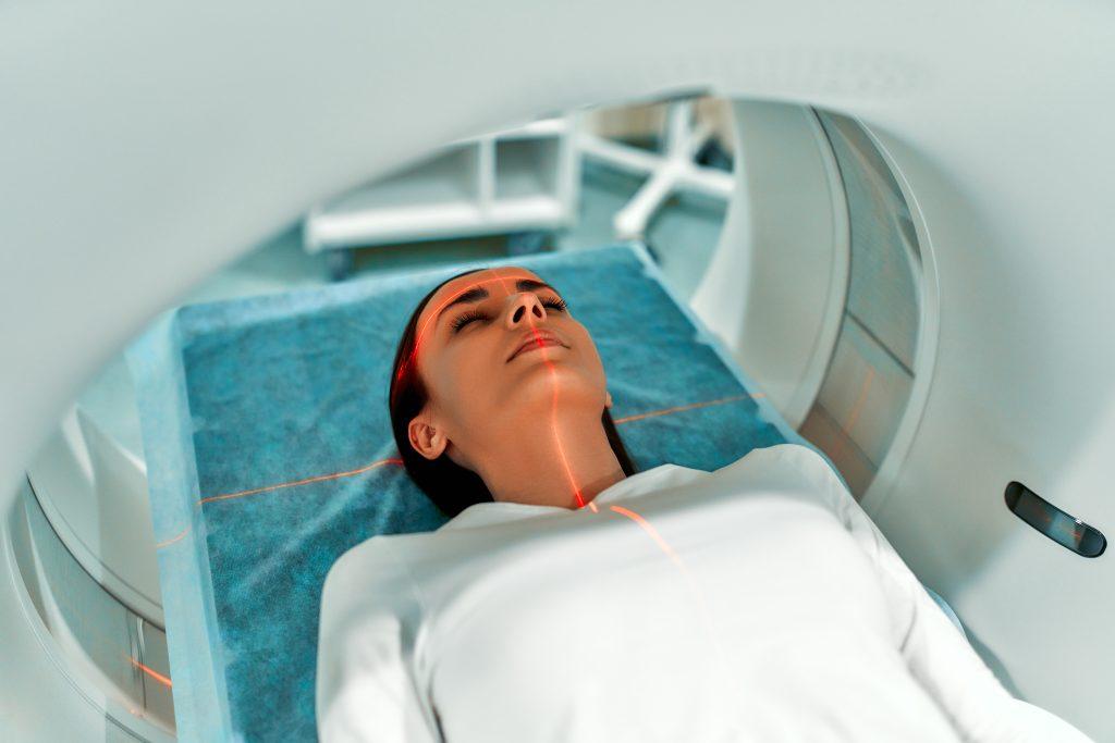 Woman undergoing an MRI CT scan