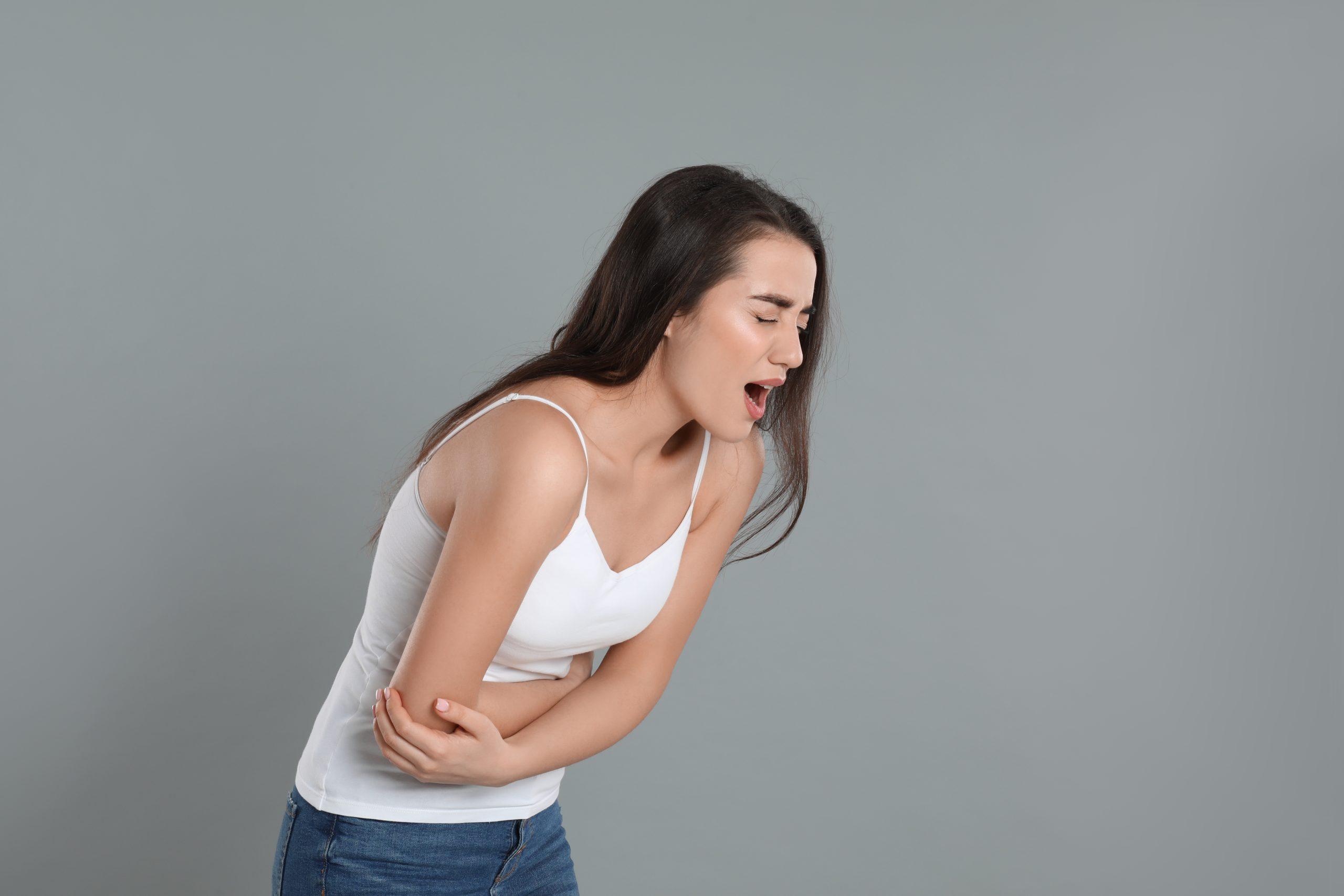 Woman experiencing stomach-ache