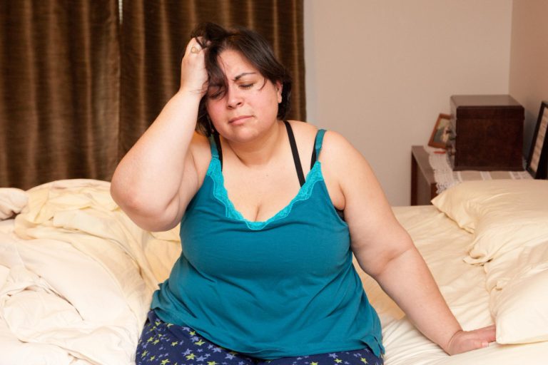 a women is felling worry about Obesity