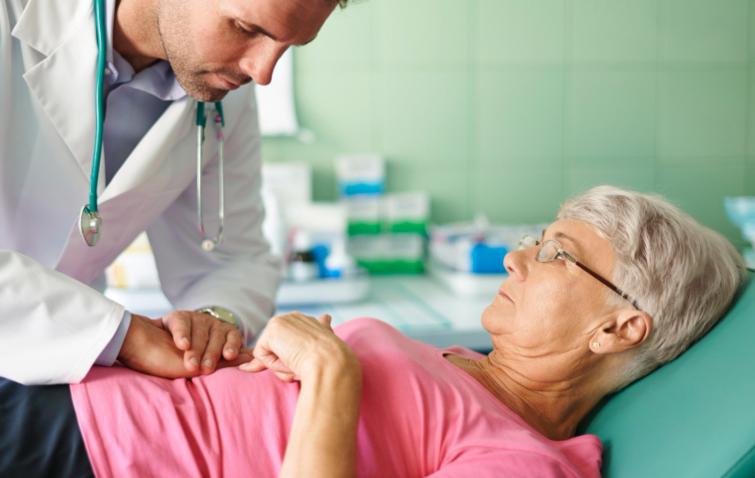 The doctor doing piles treatment of a patient