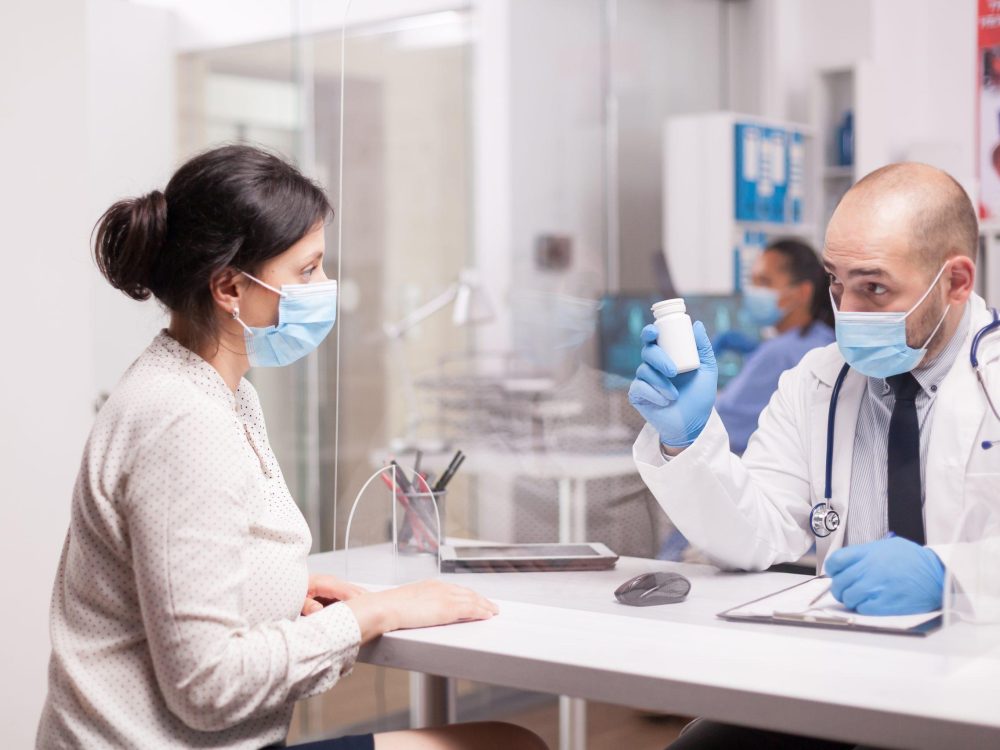 Doctor advising female patient