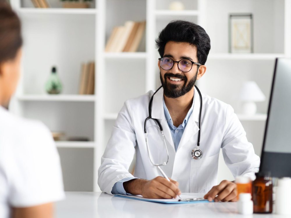 Woman consulting doctor regarding chronic pancreatitis treatment