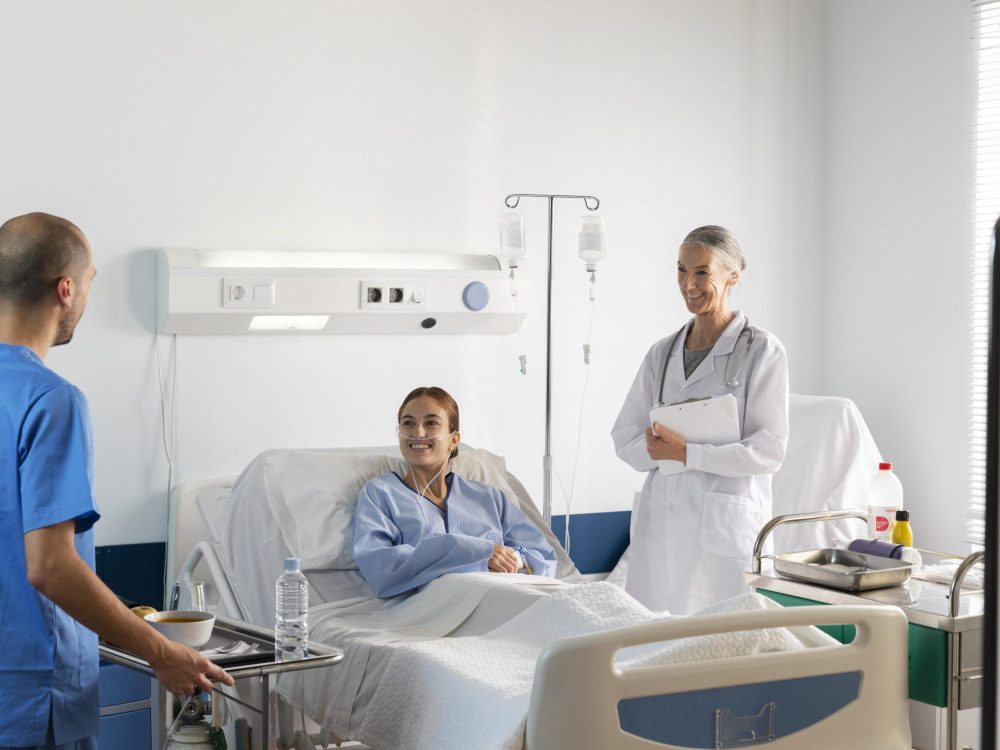 Patient having undergone surgery with doctor next to her