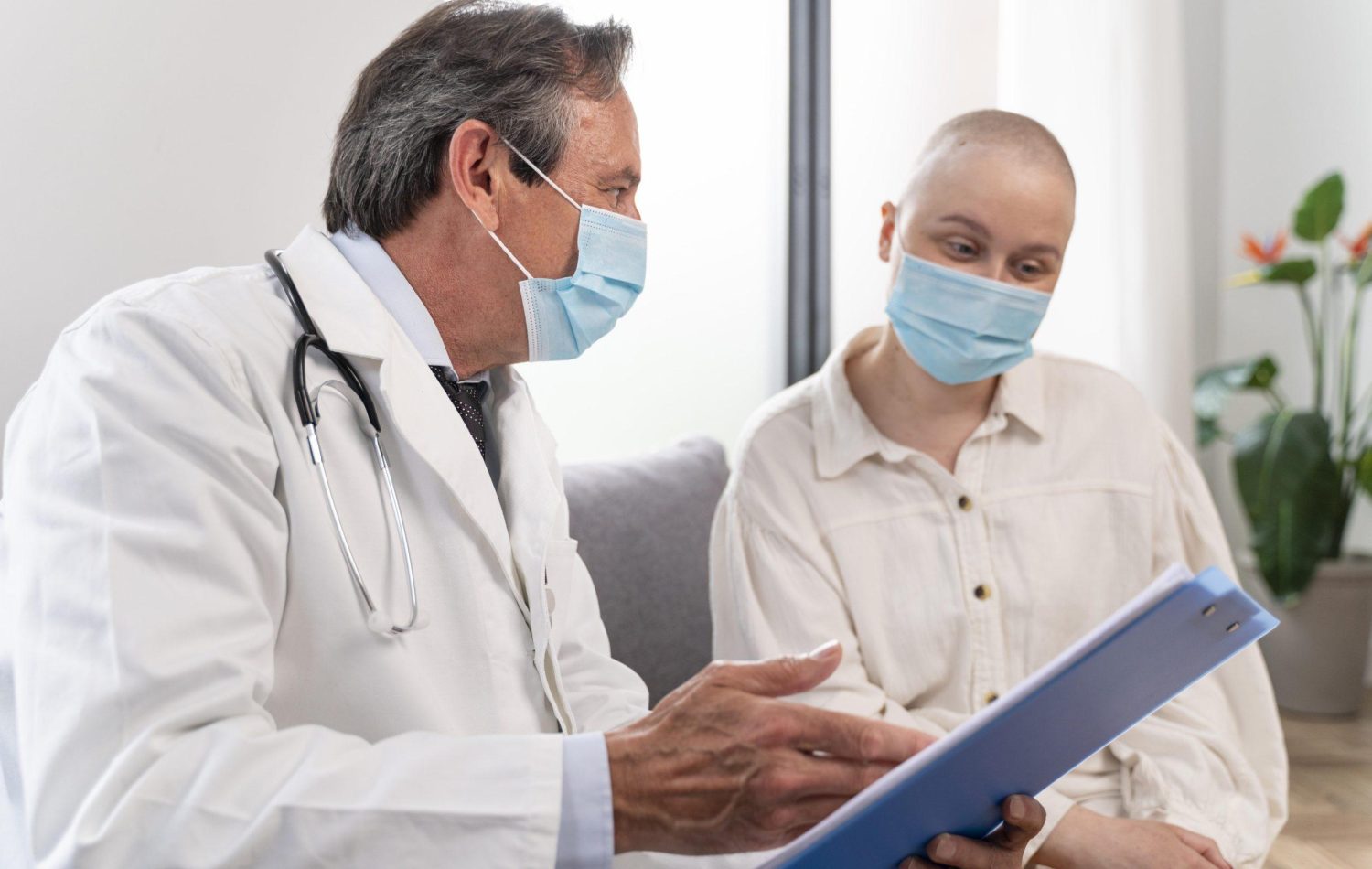 Young woman suffering from liver cancer talking to her doctor